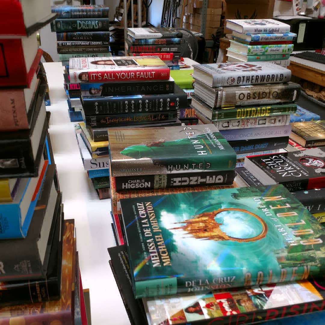 Table full of books being sorted